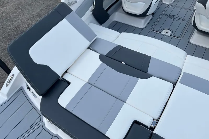 Slide: The Image of 2026 Chaparral 21 SSi boat interior with gray and white seating. - 3