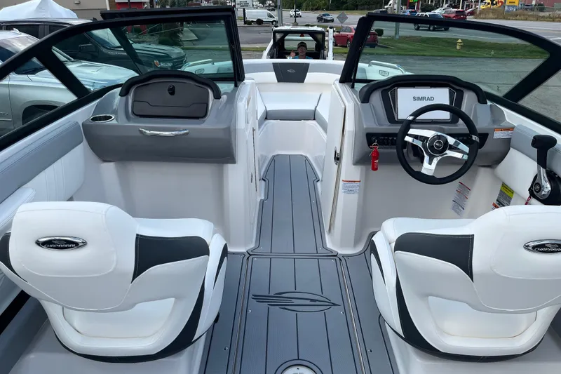 Slide: The Image of 2026 Chaparral 21 SSi boat interior with modern dashboard and seating. - 6