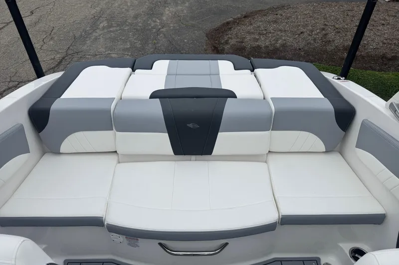 Slide: The Image of 2026 Chaparral 21 SSi boat interior with white and gray cushioned seating. - 7