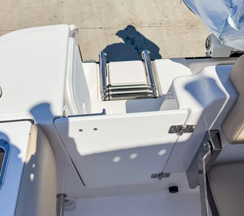 Slide: The Image of 2025 Edgewater 208CC boat with foldable ladder and seating area, viewed from above. - 9