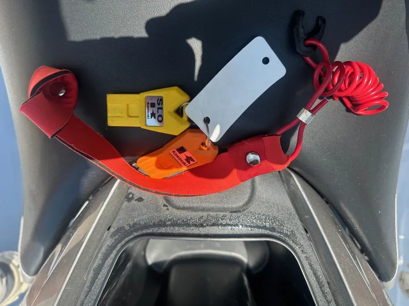Slide: The Image of Red safety lanyard and keys on a 2012 Kawasaki 300 LX Ultra jet ski. - 11