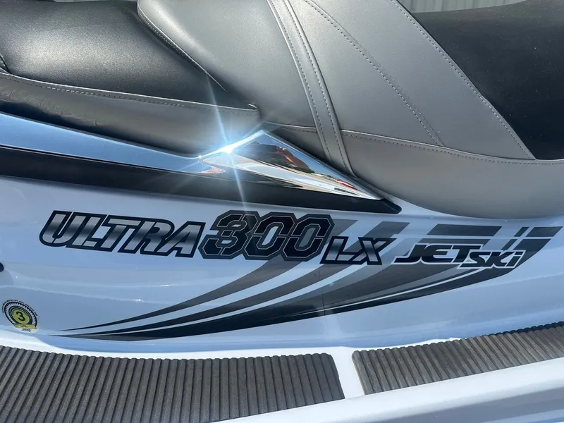 Slide: The Image of Kawasaki 300 LX Ultra Jet Ski, 2012 model, sleek design with black and gray seat. - 2