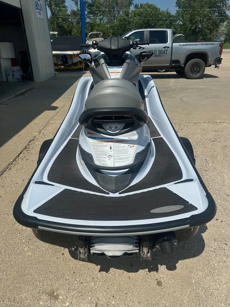 Slide: The Image of 2012 Kawasaki 300 LX Ultra jet ski parked outdoors on concrete surface. - 4