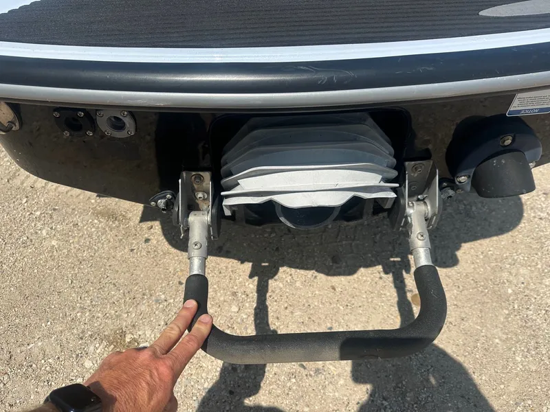 Slide: The Image of Rear view of a 2012 Kawasaki 300 LX Ultra jet ski with a hand on the handle. - 5