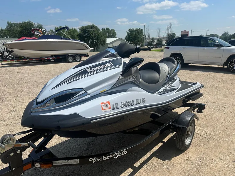 Slide: The Image of 2012 Kawasaki 300 LX Ultra jet ski on trailer, parked outdoors. - 8