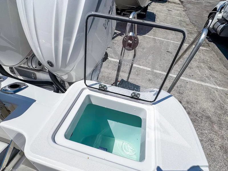 Slide: The Image of 2025 Edgewater 262CC boat with open livewell, showcasing modern design and functionality. - 23
