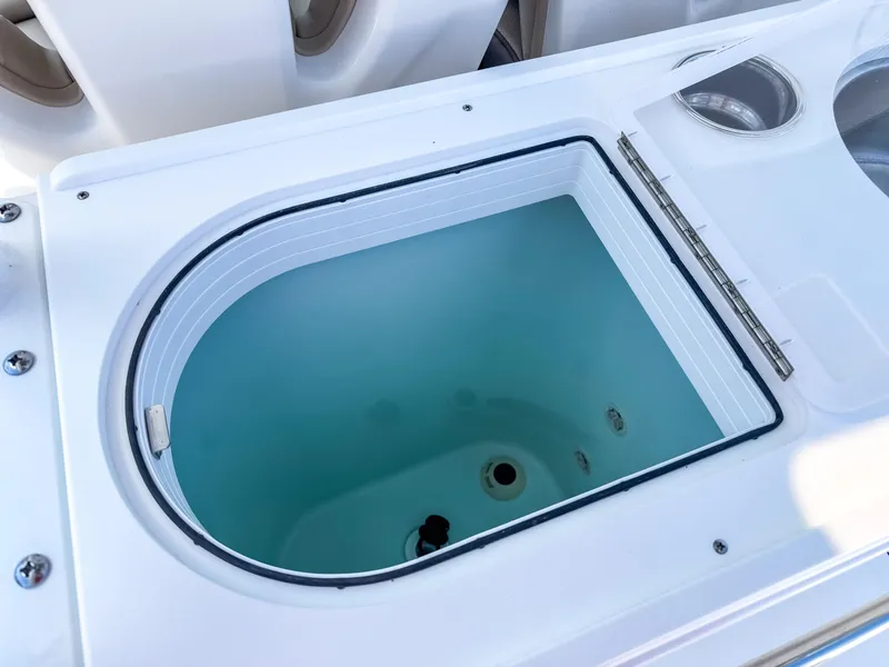 Slide: The Image of Livewell on 2025 Edgewater 325CC boat, featuring a clean, modern design. - 18