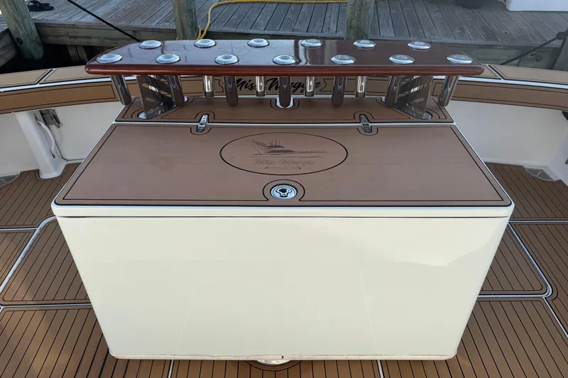 Slide: The Image of Fishing station on 2002 Viking 61 Enclosed Bridge yacht with teak deck and rod holders. - 12