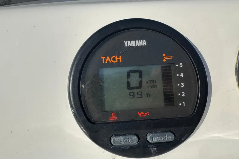 Slide: The Image of Yamaha tachometer on 2002 Viking 61 Enclosed Bridge, displaying 99 hours. - 36