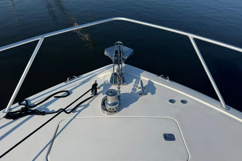 Slide: The Image of Bow of 2002 Viking 61 Enclosed Bridge yacht with anchor and railing. - 39