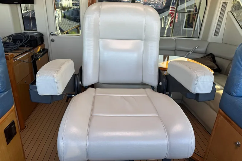 Slide: The Image of Captain's chair in 2002 Viking 61 Enclosed Bridge yacht interior. - 48