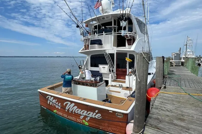 Slide: The Image of 2002 Viking 61 Enclosed Bridge yacht docked, named "Miss Maggie," Fire Island, NY. - 6