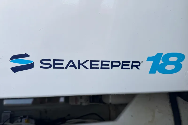 Slide: The Image of Seakeeper 18 logo on 2002 Viking 61 Enclosed Bridge yacht. - 85