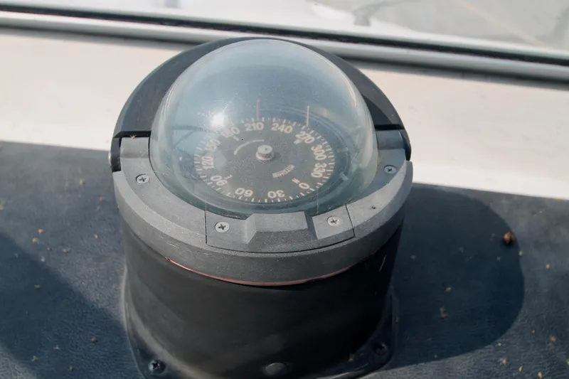 Slide: The Image of Compass on 1995 Carver 330 Mariner boat dashboard, showing navigation details. - 23