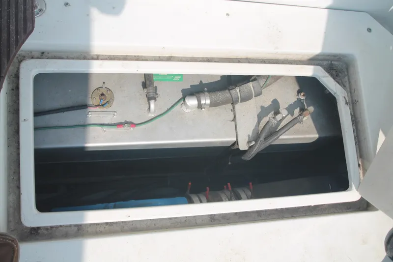 Slide: The Image of 1995 Carver 330 Mariner engine compartment with visible wiring and components. - 49