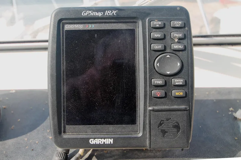 Slide: The Image of Garmin GPSmap 182C device on a 1995 Carver 330 Mariner boat dashboard. - 22