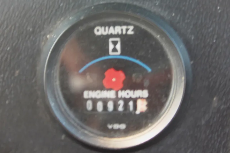Slide: The Image of Quartz engine hour meter showing 921 hours on a 1995 Carver 330 Mariner. - 27