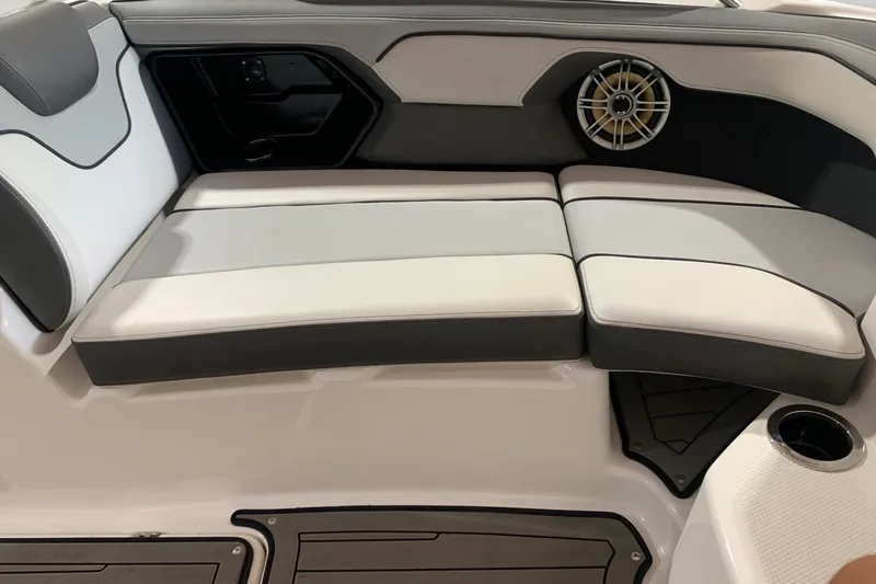 Slide: The Image of 2017 Yamaha Boats 212 Limited interior seating with speaker and cup holder. - 13