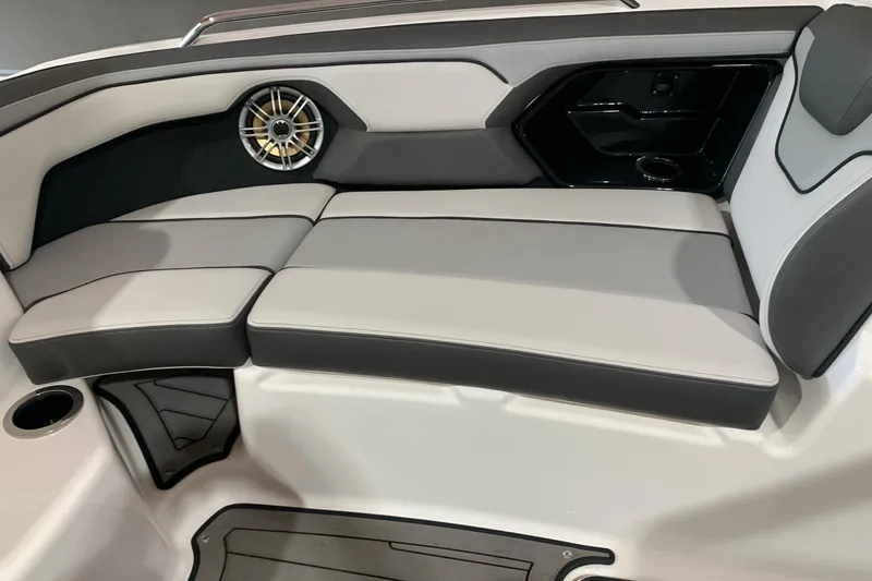 Slide: The Image of 2017 Yamaha Boats 212 Limited interior seating with speaker and cup holder. - 15