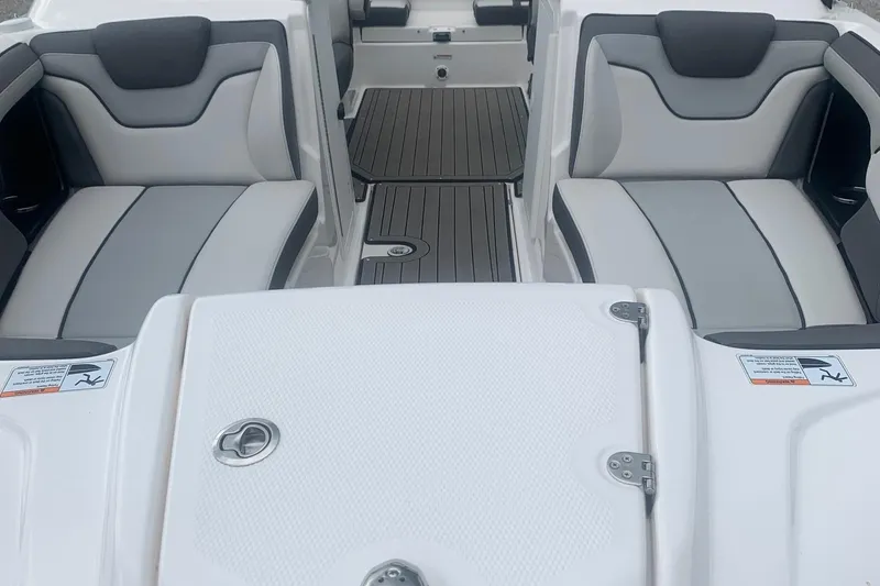 Slide: The Image of 2017 Yamaha Boats 212 Limited interior with gray seating and sleek design. - 3