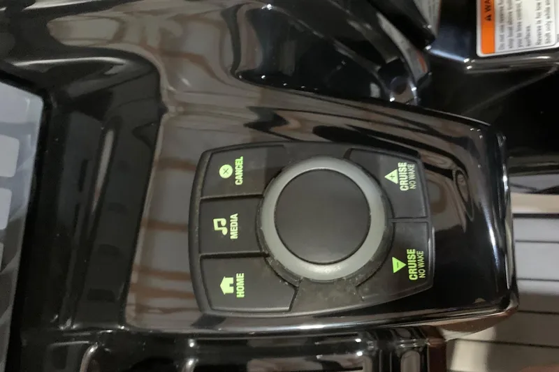 Slide: The Image of Control panel of a 2017 Yamaha Boats 212 Limited, featuring media and cruise buttons. - 9