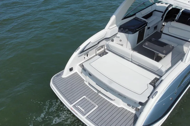 Slide: The Image of 2021 Formula 350ss boat with spacious deck and seating on calm water. - 10