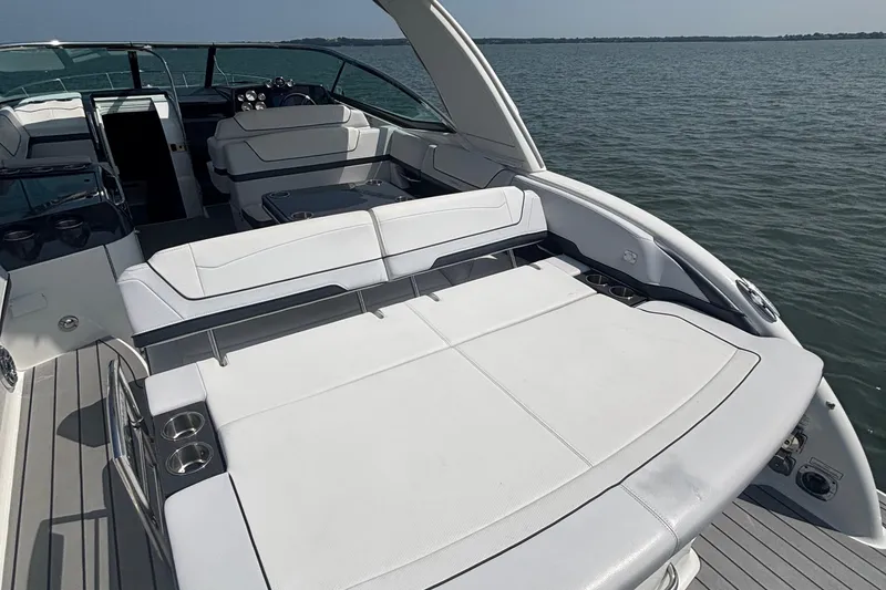 Slide: The Image of 2021 Formula 350ss boat with spacious white seating on open water. - 11
