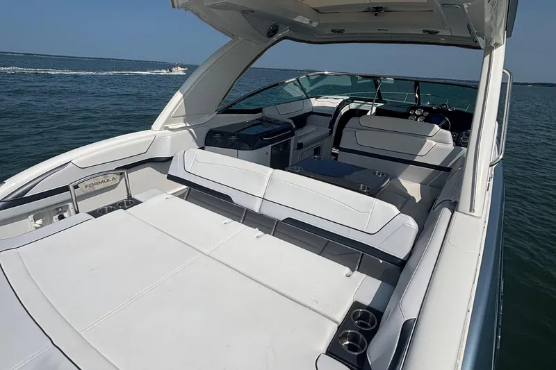Slide: The Image of 2021 Formula 350ss boat interior with spacious seating on open water. - 12