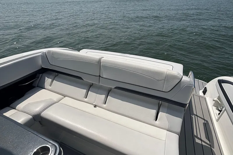 Slide: The Image of 2021 Formula 350ss boat with luxurious seating, overlooking calm waters. - 13