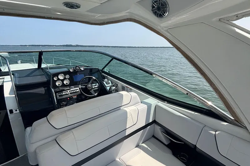 Slide: The Image of Interior of a 2021 Formula 350ss boat with sleek dashboard and seating. - 16
