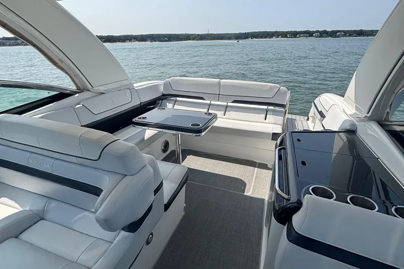 Slide: The Image of Luxurious 2021 Formula 350ss boat interior with sleek seating and table on open water. - 20