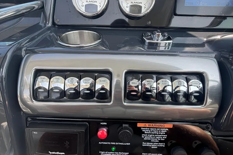 Slide: The Image of Control panel of a 2021 Formula 350ss boat with labeled switches and gauges. - 24