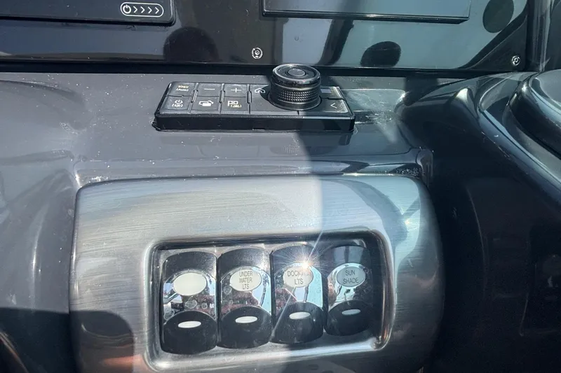 Slide: The Image of Control panel of a 2021 Formula 350ss boat with various switches and buttons. - 25