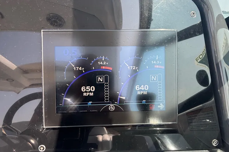 Slide: The Image of Dashboard display of a 2021 Formula 350ss boat showing RPM and temperature gauges. - 27