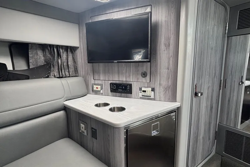 Slide: The Image of 2021 Formula 350ss interior with TV, seating, and mini fridge in modern design. - 32