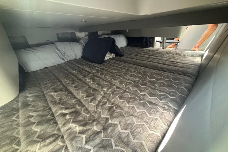 Slide: The Image of Interior cabin of 2021 Formula 350ss boat with cozy bedding and pillows. - 34