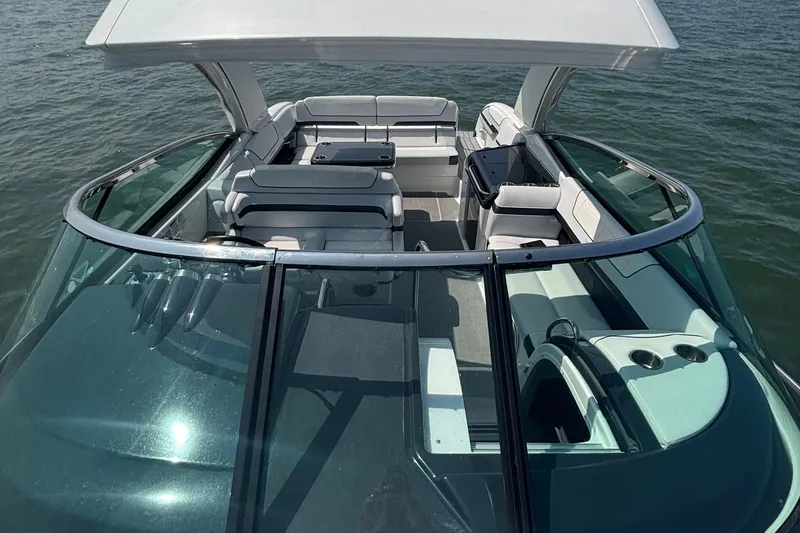 Slide: The Image of 2021 Formula 350ss boat interior with sleek design and spacious seating on water. - 38