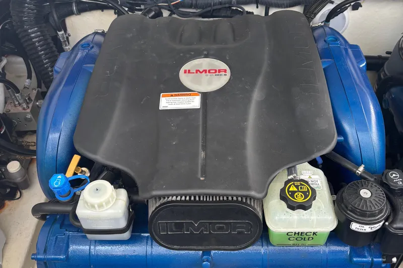 Slide: The Image of 2021 Formula 350ss engine with Ilmor cover, featuring various fluid reservoirs and components. - 41