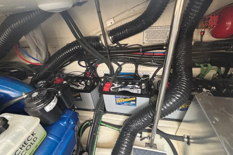 Slide: The Image of Engine compartment of a 2021 Formula 350ss with batteries and wiring. - 44