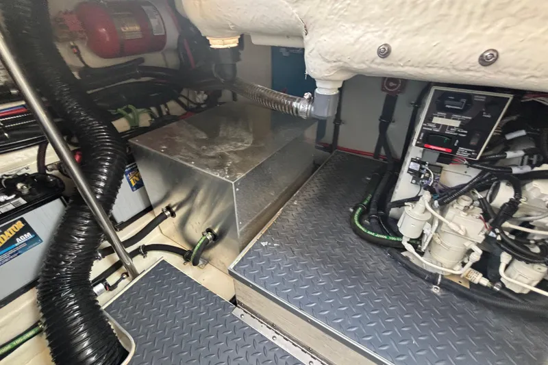 Slide: The Image of Engine compartment of a 2021 Formula 350ss boat, featuring mechanical components and wiring. - 45