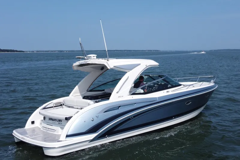 Slide: The Image of 2021 Formula 350ss boat cruising on open water under clear blue sky. - 46
