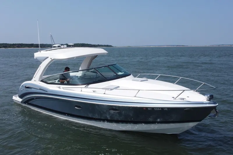 Slide: The Image of 2021 Formula 350ss boat cruising on open water, featuring sleek design and modern amenities. - 48