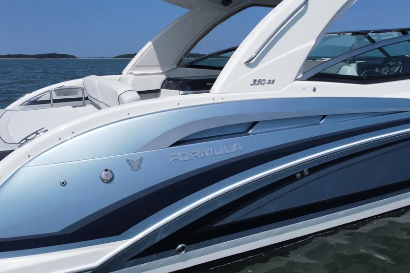 Slide: The Image of 2021 Formula 350ss boat on water, showcasing sleek design and modern features. - 5