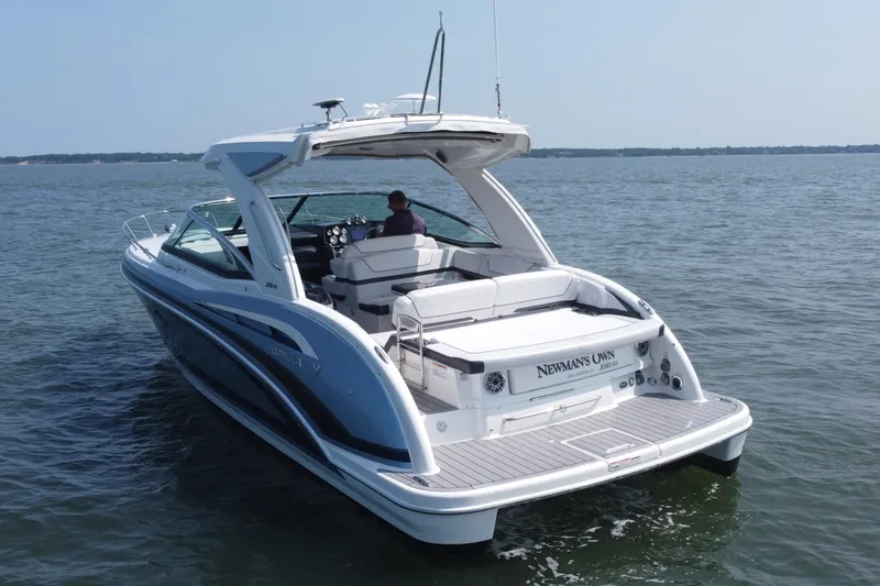 Slide: The Image of 2021 Formula 350ss boat cruising on open water, featuring sleek design and spacious deck. - 50