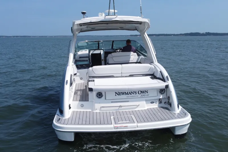 Slide: The Image of 2021 Formula 350ss boat on water, rear view, with "Newman's Own" branding. - 51