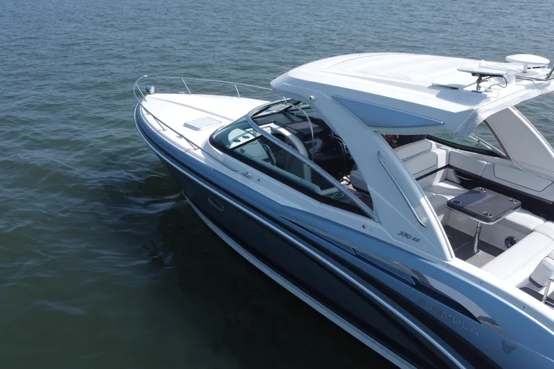 Slide: The Image of 2021 Formula 350ss boat cruising on open water, showcasing sleek design and luxury features. - 54