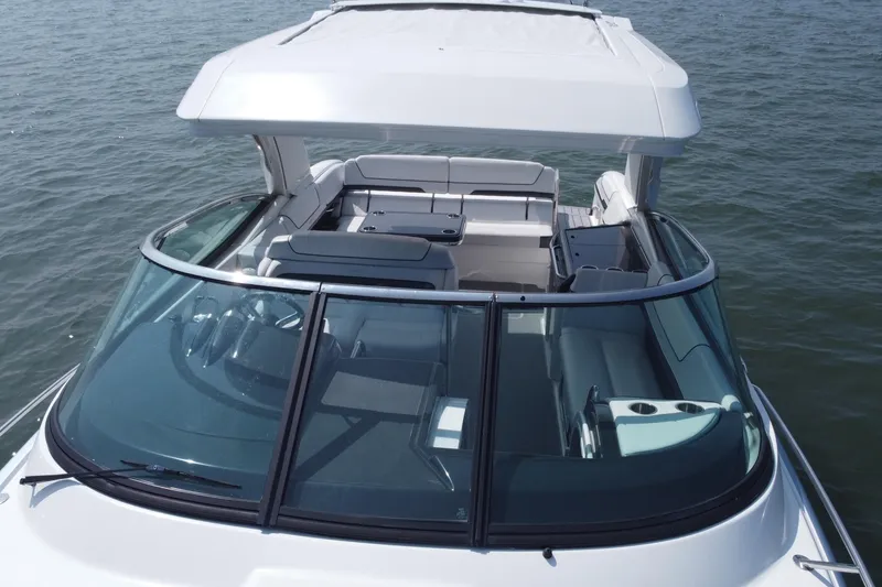 Slide: The Image of 2021 Formula 350ss boat with spacious seating and sleek design on open water. - 55