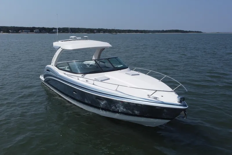 Slide: The Image of 2021 Formula 350ss boat cruising on open water under clear skies. - 56