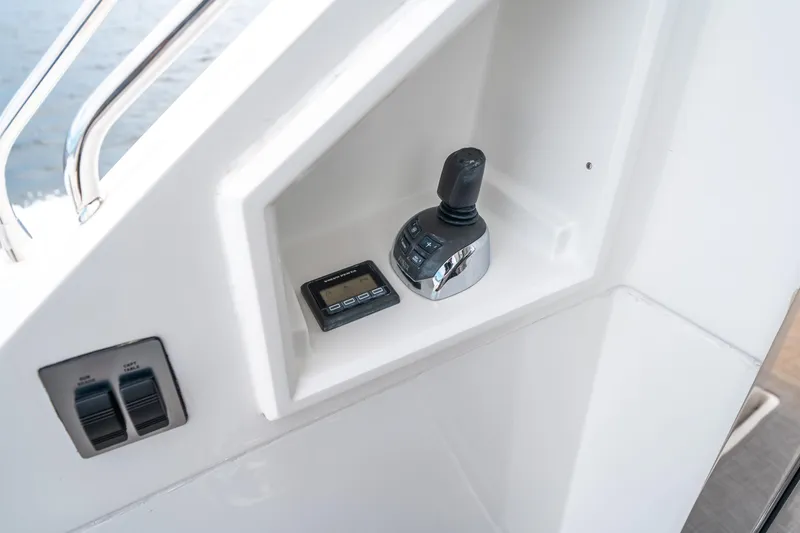 Slide: The Image of 2019 Cruisers Yachts Cantius control panel with joystick and digital display. - 13