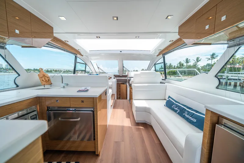 Slide: The Image of Luxurious interior of 2019 Cruisers Yachts Cantius with modern kitchen and seating area. - 23